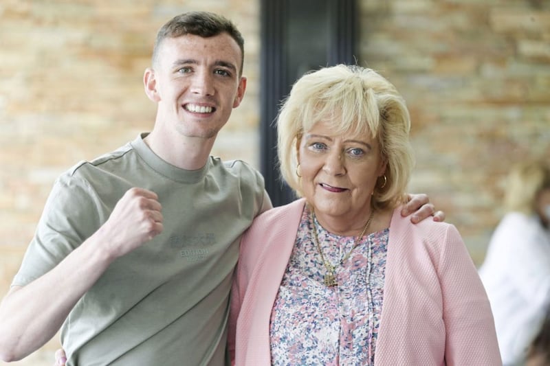 Brendan Irvine with mum Brenda at a recent County Antrim Board event in honour of the four Ulster boxers at the Tokyo Olympics. Picture by Hugh Russell 