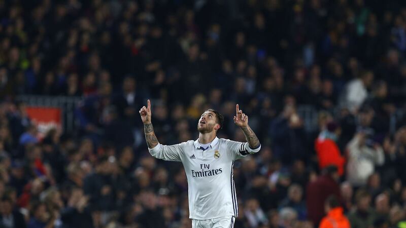Real Madrid's Sergio Ramos celebrates after scoring his side's first goal during the Spanish La Liga soccer match between FC Barcelona and Real Madrid at the Camp Nou stadium in Barcelona, Spain&nbsp;