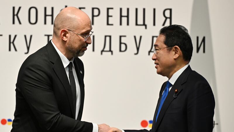Ukraine’s Prime Minister Denys Shmyhal shakes hands with Japanese Prime Minister Fumio Kishida during the Japan-Ukraine Conference for Promotion of Economic Growth and Reconstruction at Keidanren Kaikan building in Tokyo (Kazuhiro Nogi/Pool Photo via AP)