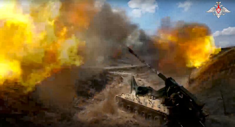 A Russian 152 mm self-propelled gun fires toward Ukrainian positions at an undisclosed location