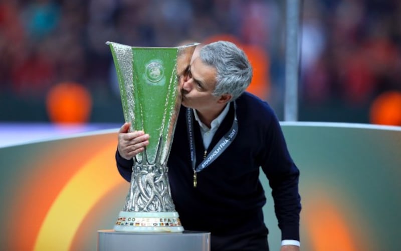 Manchester United manager Jose Mourinho and the Europa League trophy