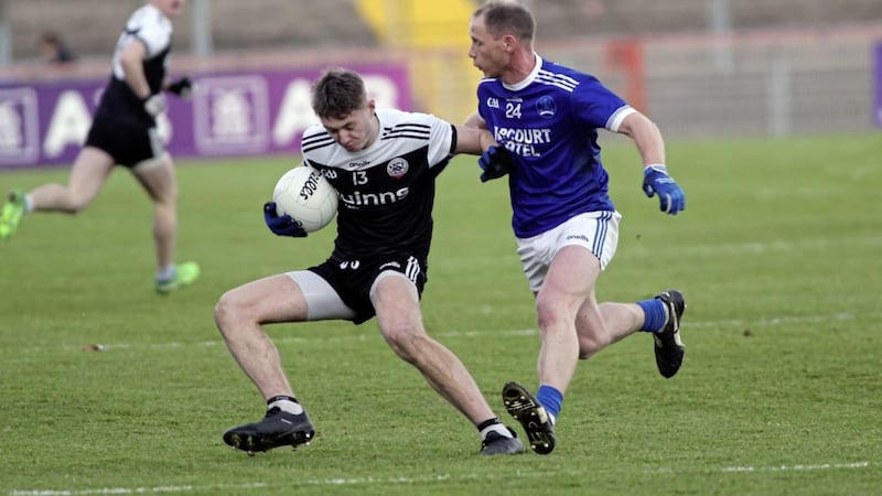 Ryan McEvoy gives Naomh Conaill&#39;s Anthony Thompson the slip in Sunday&#39;s Ulster Club Championship final at Healy Park. Picture: Seamus Loughran 