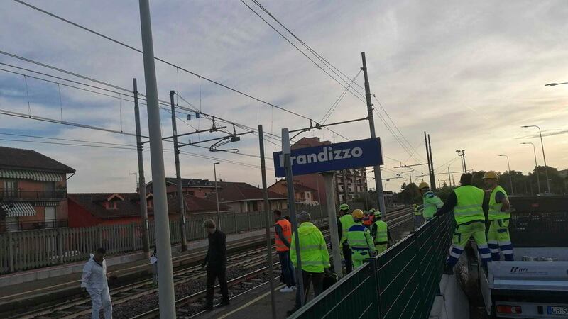 Firefighters inspect the site where five railway workers were killed at a station in Brandizzo, near Turin (LaPresse via AP)
