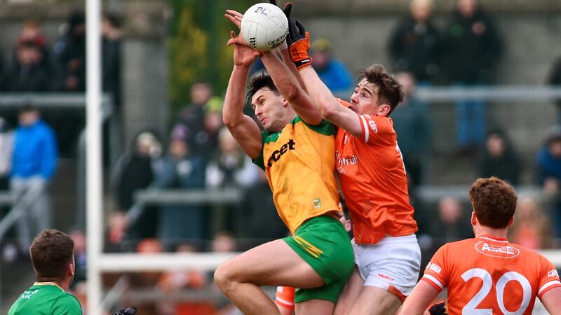 Andy Murnin and Michael Langan compete for a kickout during Armagh's draw with Donegal. Picture: John Merry