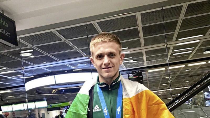 Kurt Walker with his European Games gold medal during yesterday&#39;s homecoming at Dublin airport 