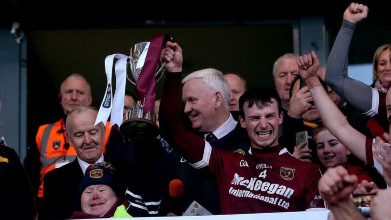 Cushendall's Paddy Burke and club mascot John McKillop hold up the AIB Ulster Four Seasons Cup&nbsp; after they defeated Ballycran in today's Ulster club&nbsp; senior hurling final at the Athletic Grounds&nbsp; <br />Picture by S&eacute;amus Loughran