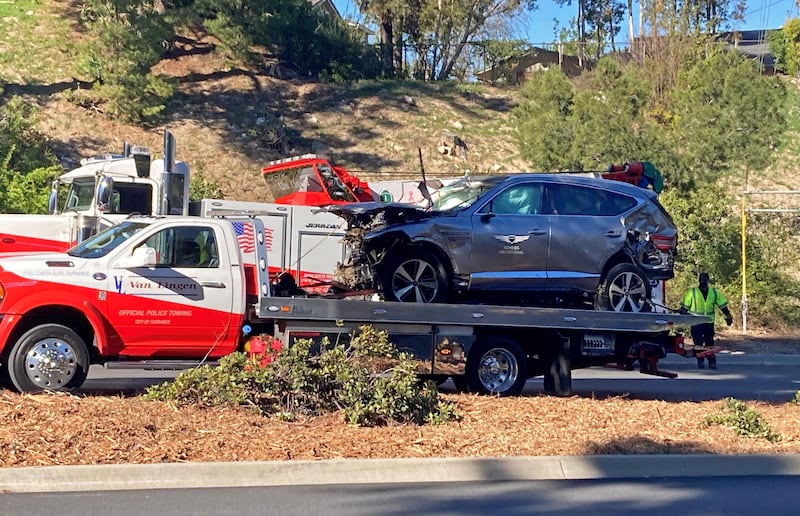 The vehicle driven by Tiger Woods on the back of a truck in Los Angeles after he suffered severe leg injuries when the vehicle rolled over