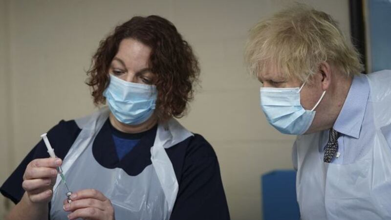 &nbsp;Prime Minister Boris Johnson is shown how to prepare the vaccine by advance nurse practitioner Sarah Sowden during a visit to a coronavirus vaccination centre in Batley, West Yorkshire.
