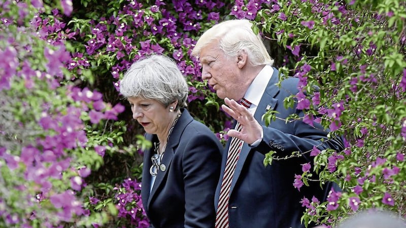 US president Donald Trump talks with Theresa May in Taormina, Italy at a meeting of the G7 PICTURE: Luca Bruno/AP 