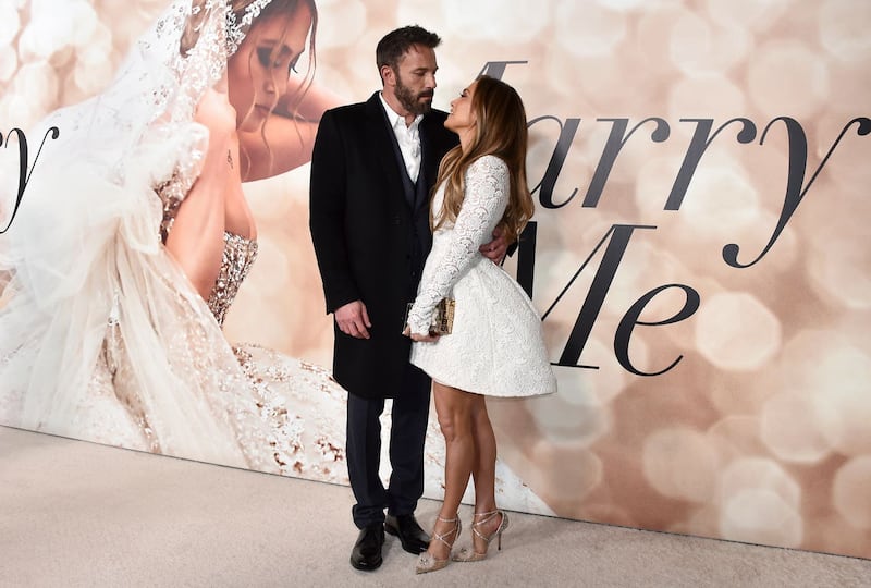 Jennifer Lopez, right, and Ben Affleck attend a photo call for a special screening of “Marry Me” at DGA Theater on Feb. 8, 2022, in Los Angeles