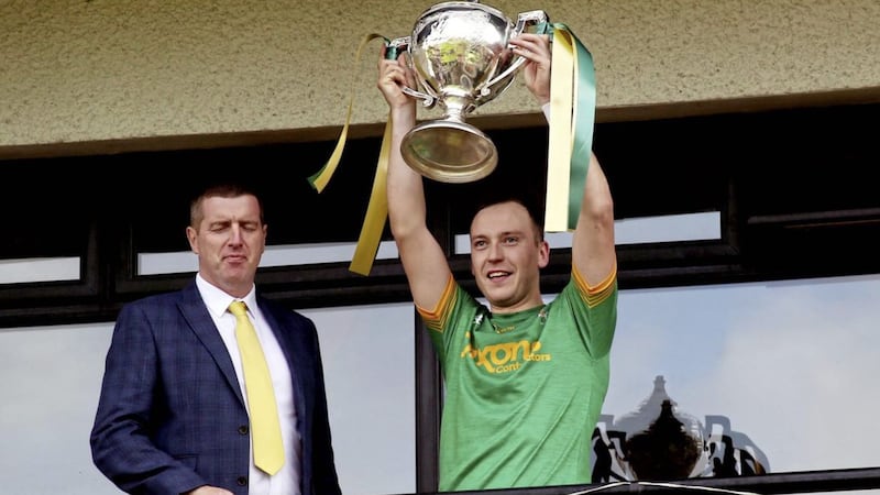 Paul Shiels lifts the Volunteer Cup after Dunloy defeated Cushendall Picture: Seamus loughran 
