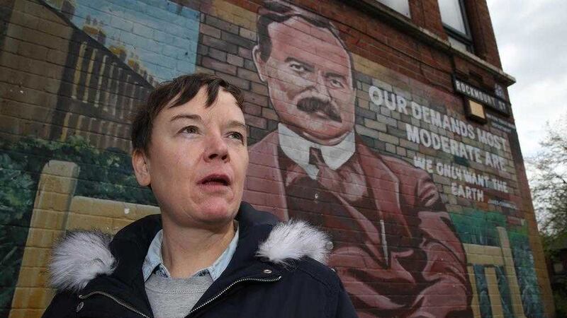 Donna Dougall, great-granddaughter of James Connolly, in front of a mural in his memory off Belfast&#39;s Falls Road. Picture by Hugh Russell 