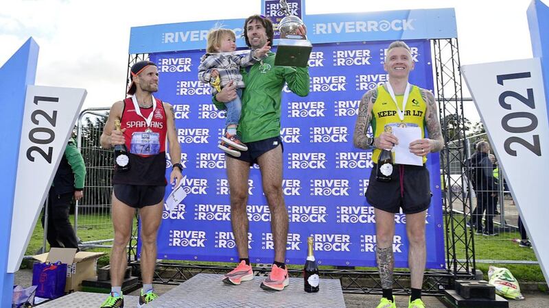 Irish Olympian Mick Clohisey, pictured with his son, Paul, won yesterday&#39;s Belfast City Marathon. He is pictured with Kyle Doherty, who came second and Colin Herron, who came third. Picture: Arthur Allison/ Pacemaker Press 