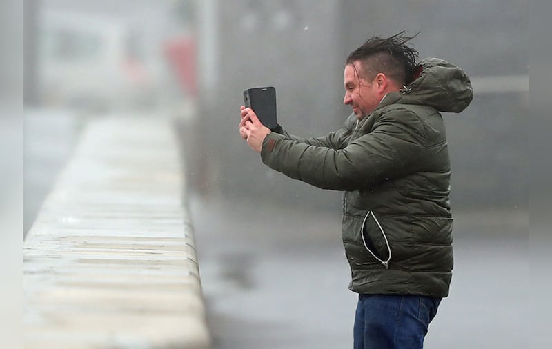 The emergency services are urging people to stay away from open water, cliffs, harbours etc.&nbsp;A man take selfies in waves and high wind at Lahinch in County Clare. Picture by&nbsp;Niall Carson, PA Wire&nbsp;