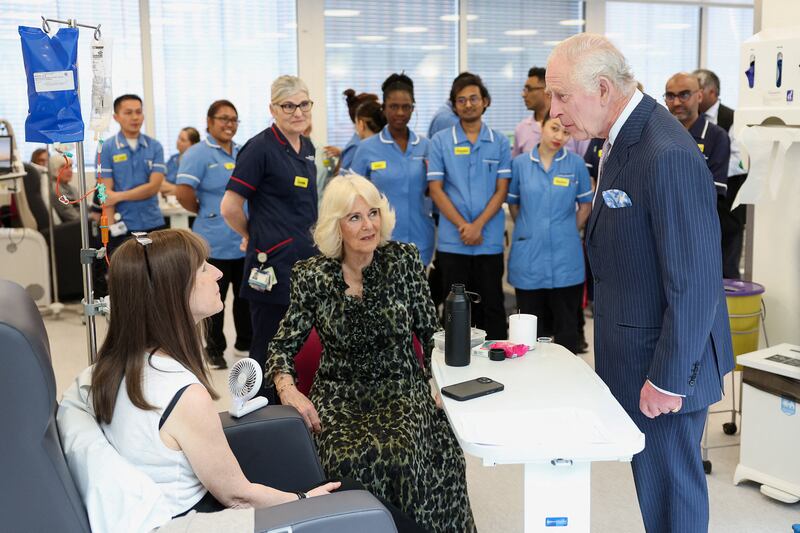 The royal couple chat to a patient at the University College Hospital Macmillan Cancer Centre,