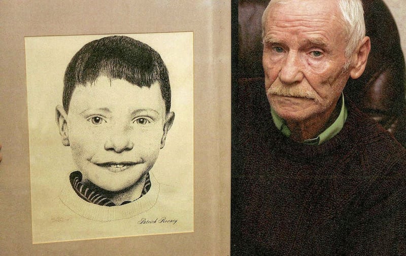 The late Neely Rooney with a portrait of his son Patrick (9), the first child victim of the Troubles 