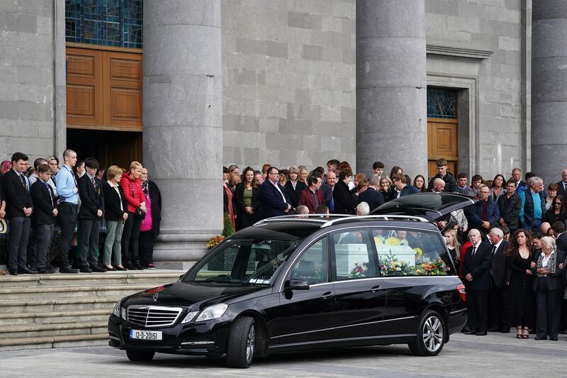 Mourners gather behind the hearse carrying the coffin bearing the remains of Mikey (2) and Thelma Dennany (5) at St Mel’s Cathedral, Longford, following their funeral mass. The brother and sister died in a car fire in Co Westmeath last week. 