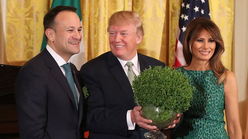 Taoiseach Leo Varadkar presents US President Donald Trump with a bowl of shamrock as Melania Trump looks on during the annual presentation ceremony at the White House in Washington DC, USA&nbsp;
