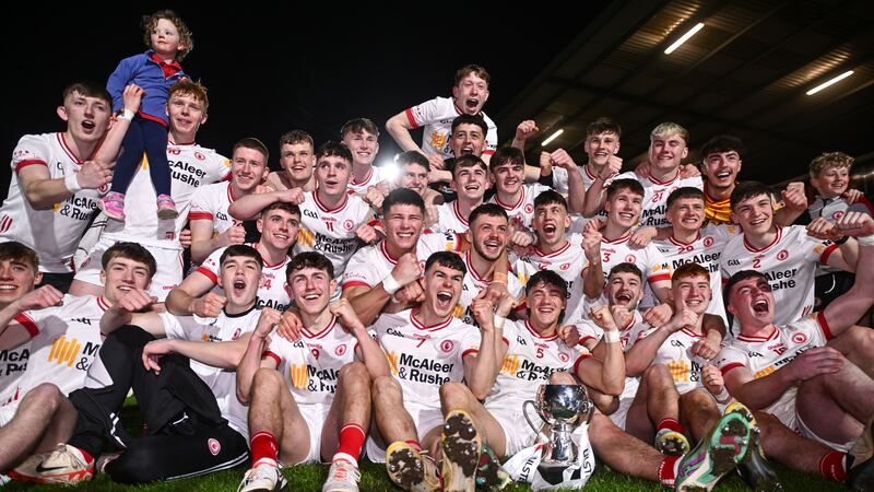 Tyrone players celebrate with the Corn Dhónaill Uí Mhurchú cup after the EirGrid Ulster GAA U20 Football Championship Final match between Derry and Tyrone at the Box-It Athletic Grounds in Armagh.