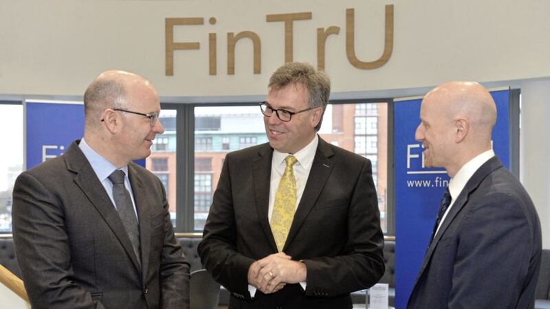 Announcing the FinTrU jobs are its chief executive Darragh McCarthy (left) and Belfast office site head Stephen Shaw, pictured with Invest NI chief executive Alastair Hamilton 