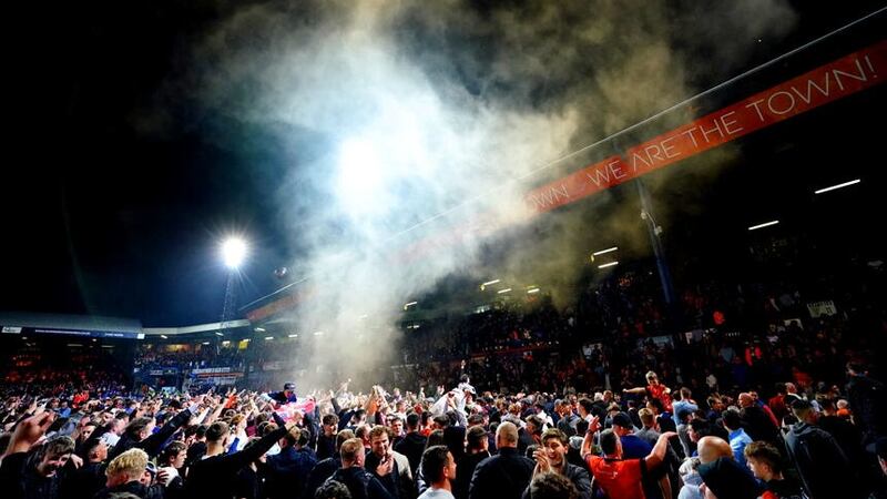 Luton fans celebrate on the pitch after victory over Sunderland (Zac Goodwin/PA)