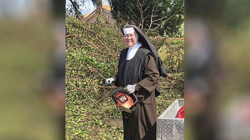 CLEAR-UP: Sister Margaret Ann holds a chainsaw near Miami, Florida. Police said the nun was cutting trees to clear the roadways around Archbishop Coleman Carrol High School in the aftermath of Hurricane Irma 						  PICTURE: Miami-Dade Police Department via AP 