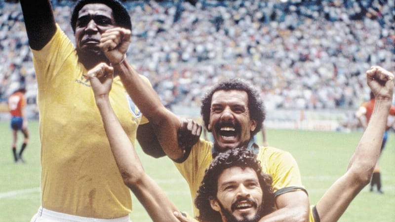 Brazil&#39;s Socrates with Junior and Julio Cesar during the 1986 World Cup finals 