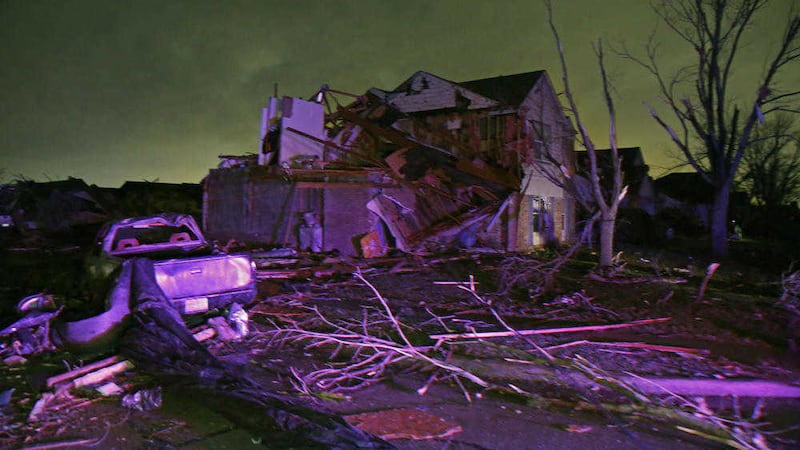               Debris lies on the ground near a home that was heavily damaged by a tornado in Rowlett, Texas, Saturday, Dec. 26, 2015. Tornadoes swept through the Dallas area after dark on Saturday evening causing significant damage. (Guy Reynolds/The Dallas Morning News via AP) MANDATORY CREDIT; MAGS OUT; TV OUT; INTERNET USE BY AP MEMBERS ONLY; NO SALES             