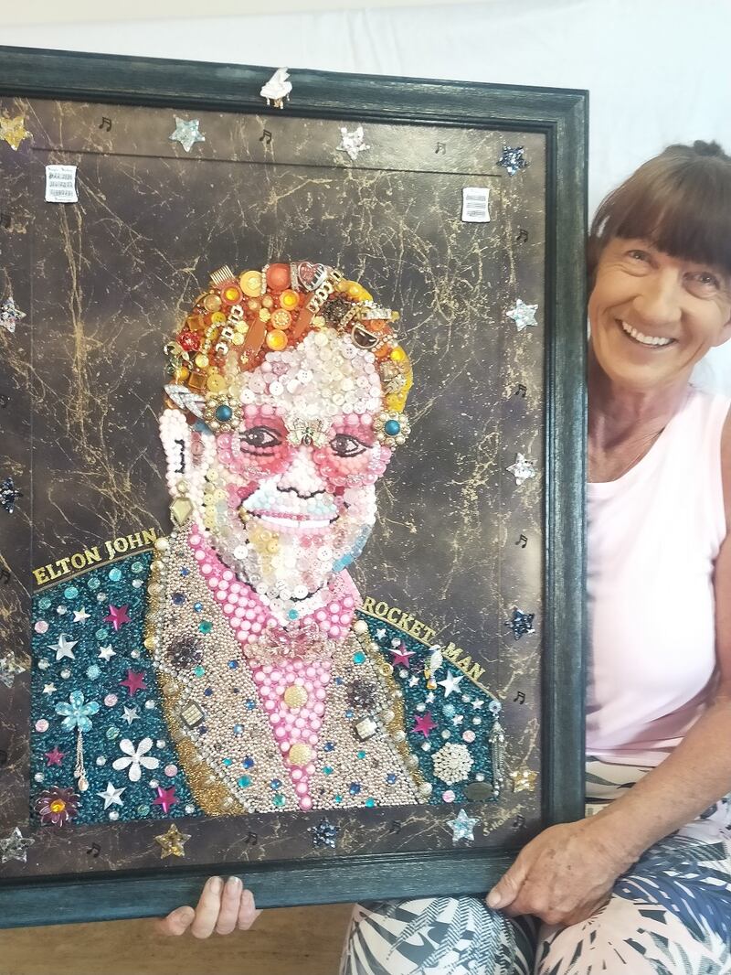 Mrs Harrex holding her depiction of Sir Elton John