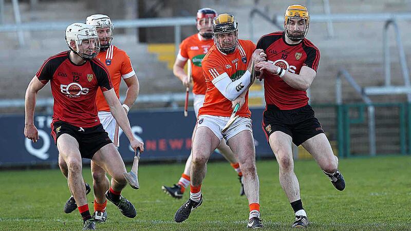 Down's Caolan Bailie and Donal Hughes and Armagh's Cormac Toner do battle at the Athletic Grounds <br />Picture by Phillip Walsh&nbsp;