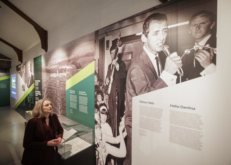 Dr Orlaith McBride, director of the National Archives Ireland, looking at an image of the Miami Showband
