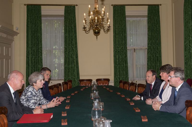 British Prime Minister Theresa May sits with First Secretary of State Damian Green (left), and Parliamentary Secretary to the Treasury, and Chief Whip, Gavin Williamson (third left) as they talk with DUP leader Arlene Foster (second right), DUP Deputy Leader Nigel Dodds (third right), and DUP MP Sir Jeffrey Donaldson inside 10 Downing Street, London. The DUP has agreed a deal to support the minority Conservative government&nbsp;