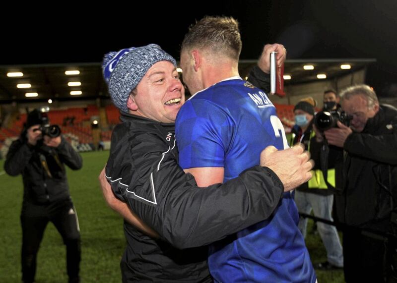 Mickey Graham celebrates with Padraig Faulkner after Cavan ended a 23-year Ulster title wait at the Athletic Grounds in November 22. Picture by Seamus Loughran 