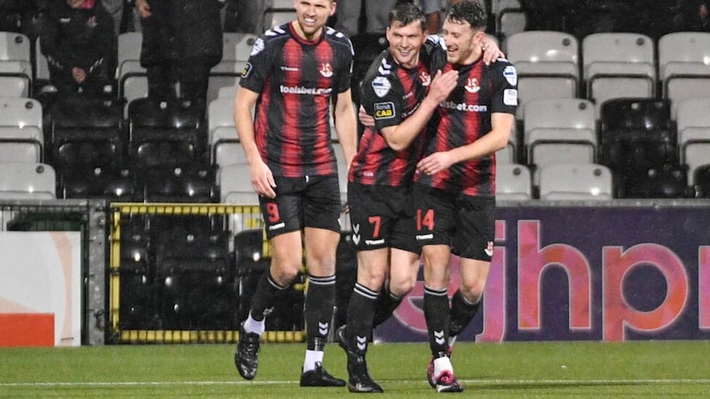 Philip Lowry celebrates his goal for Crusaders with team-mates