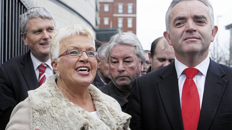 Former DUP councillor Ruth Patterson is flanked by Jonathan Bell outside court in 2013 after charges that followed a Facebook post she made were dropped. Picture by Bill Smith 
