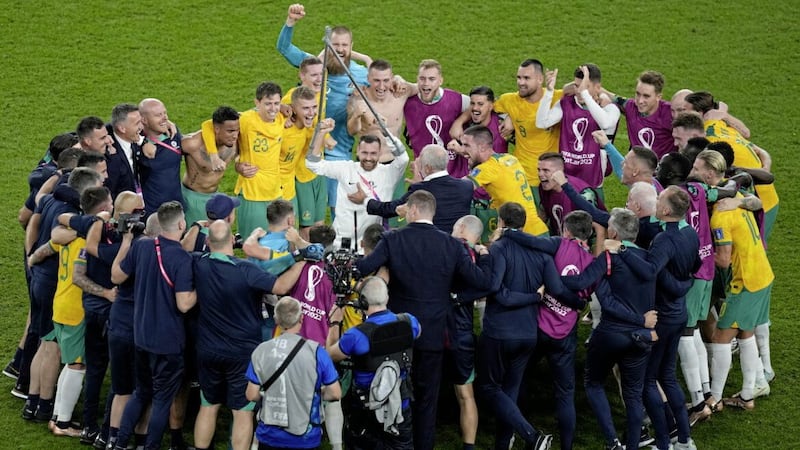 Australia&#39;s players celebrate victory over Denmark at the World Cup in Qatar 