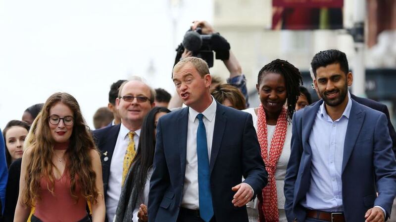 Liberal Democrat Leader Tim Farron, centre, accompanied by party supporters, arrives to deliver his keynote speech on the final day of the Liberal Democrats autumn conference in Brighton Picture by Gareth Fuller, Press Association