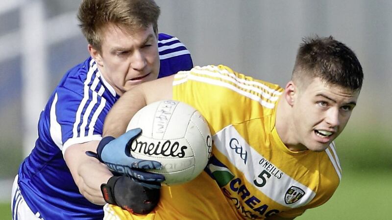 Antrim&#39;s Paddy McBride gets away from Laois&#39;s David Conway. Picture: Cliff Donaldson. 