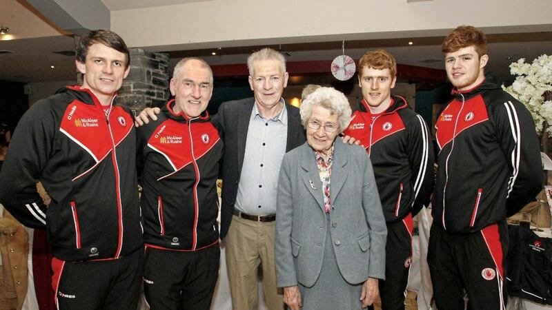 Eskra lady Cassie Kelly pictured with son Brian, Tyrone manager Mickey Harte and players Aidan McCrory, Peter Harte and Cathal McShane  