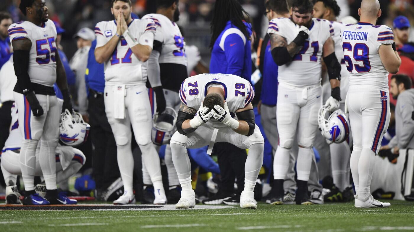 Buffalo Bills offensive tackle Spencer Brown (79) pauses as Damar Hamlin is examined by medical staff during the first half of an NFL football game against the Cincinnati Bengals, Monday, Jan. 2, 2023, in Cincinnati. (AP Photo/Emilee Chinn)