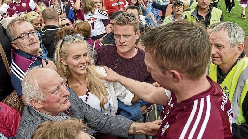 Galway&rsquo;s Joe Canning reaches into the stand to celebrate with his girlfriend Mary Walsh and his father Sean and following the Tribe&rsquo;s All-Ireland Senior Hurling Championship final victory over Waterford at Croke Park last Sunday Picture by Sportsfile 
