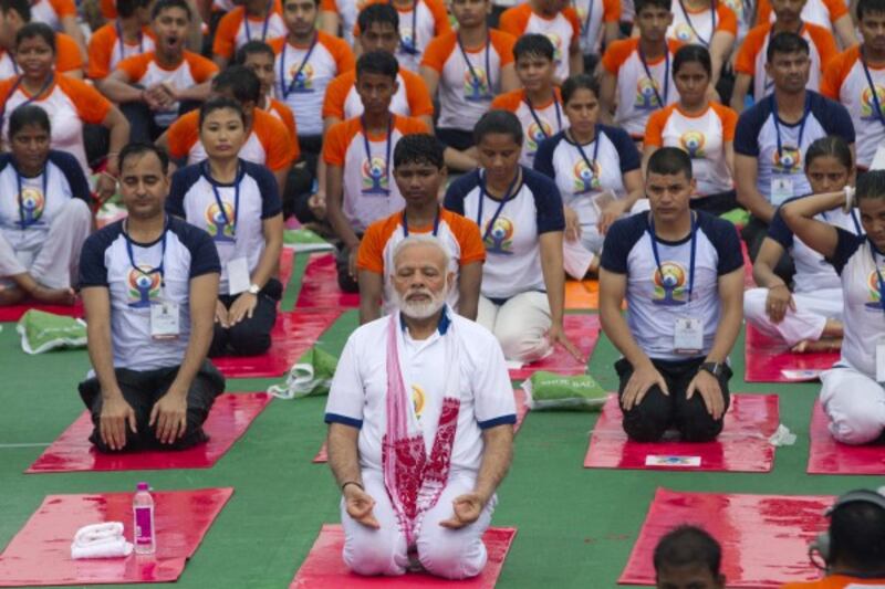Prime Minister Modi performs yoga in Lucknow, India (Rajesh Kumar Singh/AP)