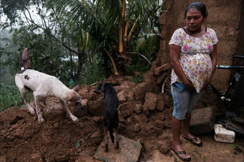 A woman stands by the fallen wall of her house after the passage of Hurricane Iota in Siuna, Nicaragua, on November&nbsp;17 2020. Picture by Carlos Herrera, AP