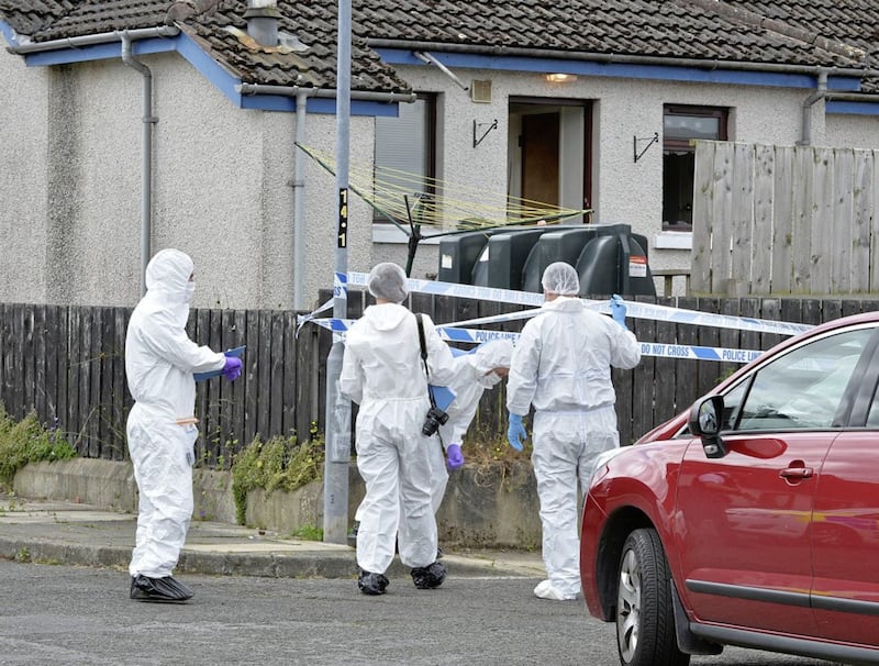 Forensic PSNI officers pictured arriving at the scene of the killing
