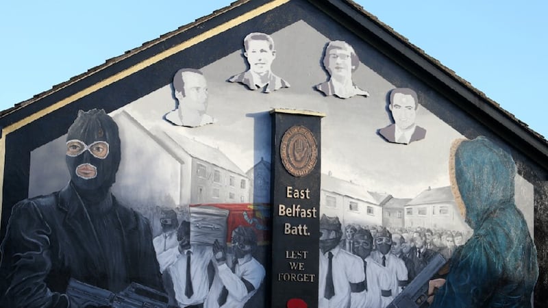 An East Belfast UVF mural featuring an image of Robert 'Squeak' Seymour (left).