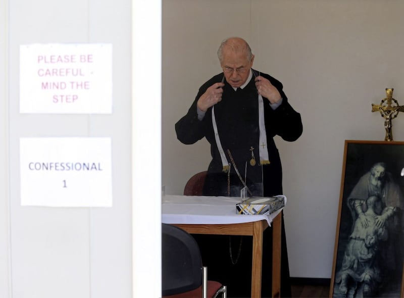 Fr Fonsie Doran prepares for confessions at the Clonard Novena Picture Mal McCann. 