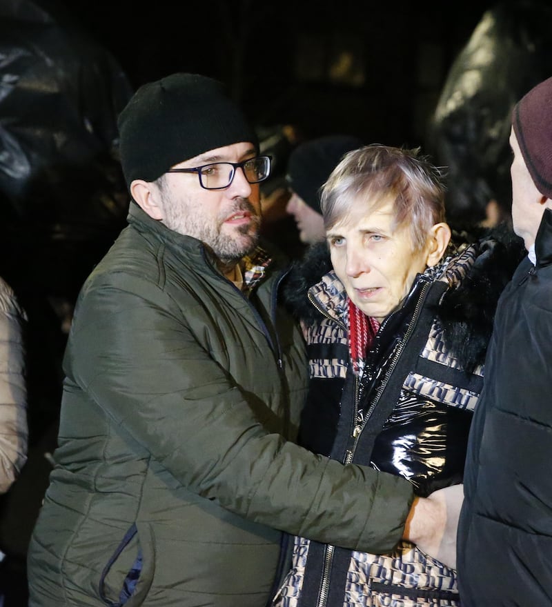 Natalie McNally's grieving brother Brendan comforts his mother Bernadette at the vigil in Lurgan. Picture by Philip Walsh