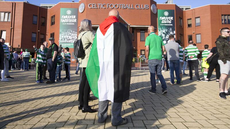 A Celtic fan wears a Palestinian flag outside Celtic Park before last week's Uefa Champions League qualifying play-off<br />Picture by PA