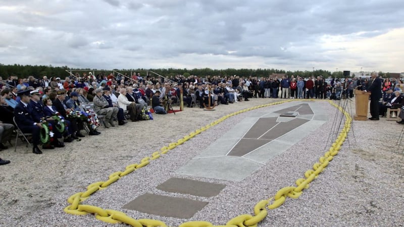               Audience members listen to a speaker during a ceremony marking the 80th anniversary of when the German airship Hidenburg burst into blames, Saturday, May 6, 2017, in Lakehurst, N.J.  For the first time in five years the crash site of the Hindenburg that is located at Joint Base McGuire- Dix -Lakehurst was briefly open to the public. (Mark R. Sullivan/NJ Advance Media via AP)             