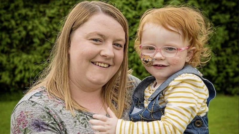 Ballyclare woman Josephine Armstrong, who is pictured with her six-year-old daughter, Paige, who has Mitochondrial disease, sad the grant from Sense would be used to &quot;get some oil heating&quot; and pay for electricity 